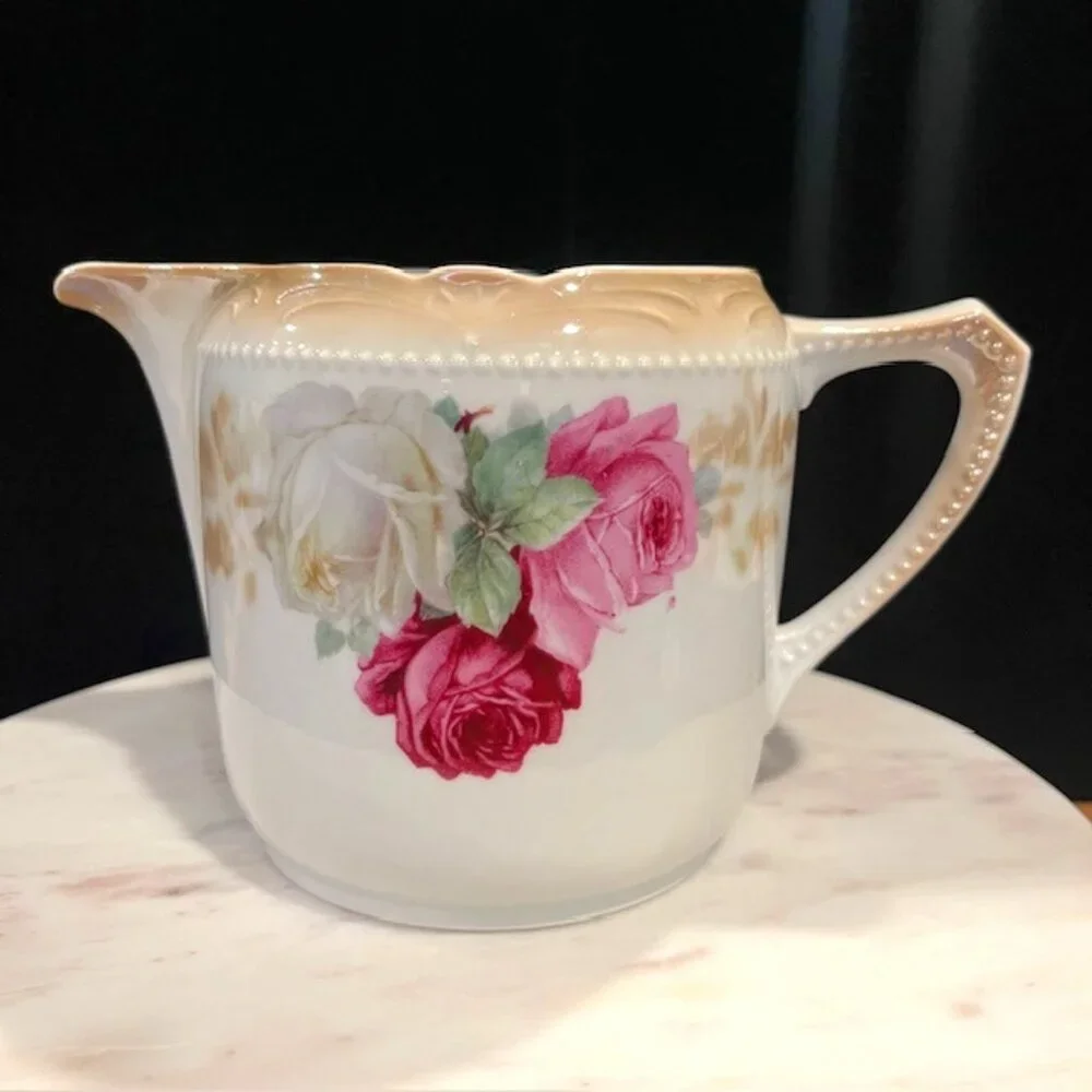 German Porcelain Large Creamer with Roses and Beaded Handle